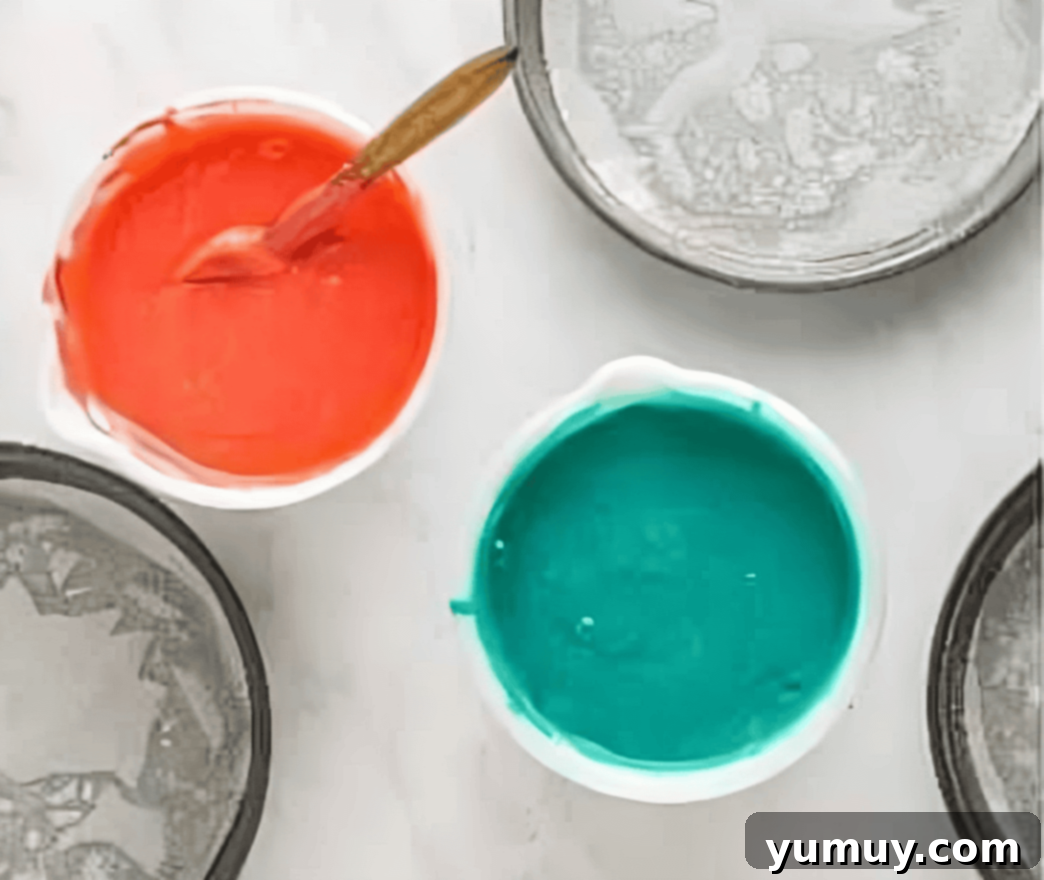 pink and blue cake batter in separate bowls.