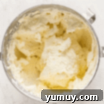 fluffy frosting in a stand mixer bowl.