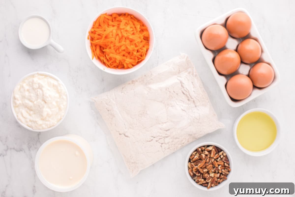 An inviting overhead shot showcasing all the fresh, high-quality ingredients laid out for baking a carrot bundt cake.