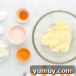 overhead view of creamed butter and sugar in a glass bowl.