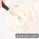 Effortless Red Velvet Cake from a Mix 14 frosting spread over red velvet cake.