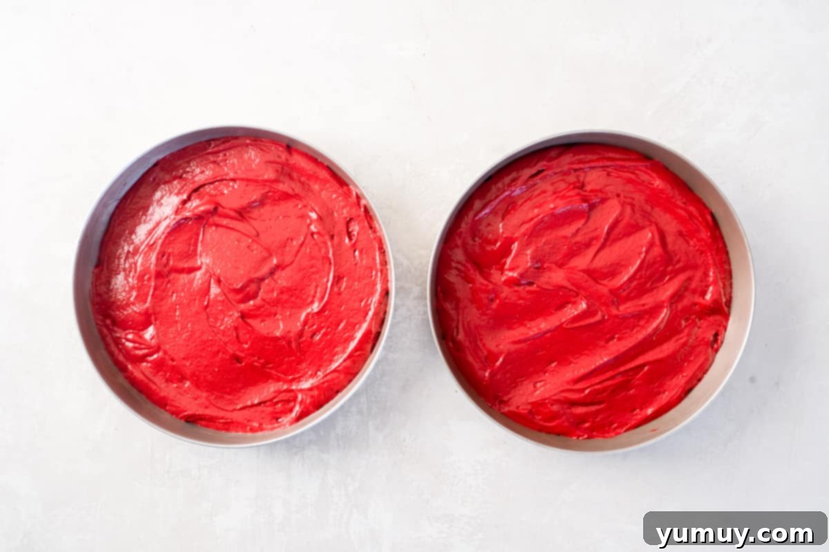 Effortless Red Velvet Cake from a Mix 19 red velvet cake batter split into 2 round cake pans.