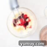 Effortless Red Velvet Cake from a Mix 7 food coloring added to red velvet cake batter with a hand mixer.