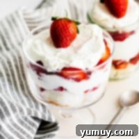 Featured image of a stunning strawberry shortcake trifle, showcasing its vibrant layers.