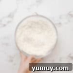 Flour in a glass bowl.