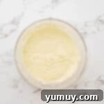 Cake batter in a glass bowl.