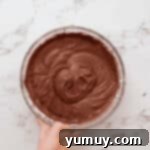 Devil's food cake batter in a glass bowl.