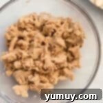 Homestyle Dutch Apple Pie 7 streusel topping mixed in a glass bowl.