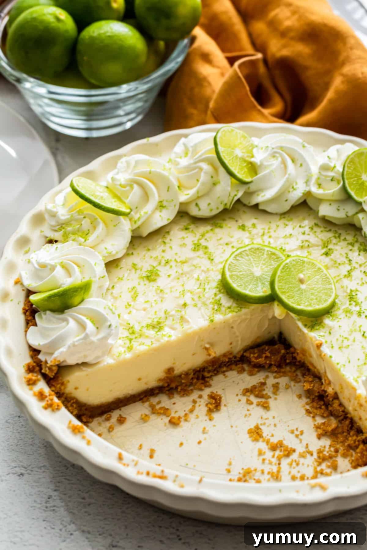 Sunshine Slice 2 homemade key lime pie, with slices removed. A perfect summer dessert.