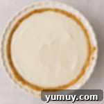 Sunshine Slice 7 key lime pie filling in a graham cracker crust, freshly baked.