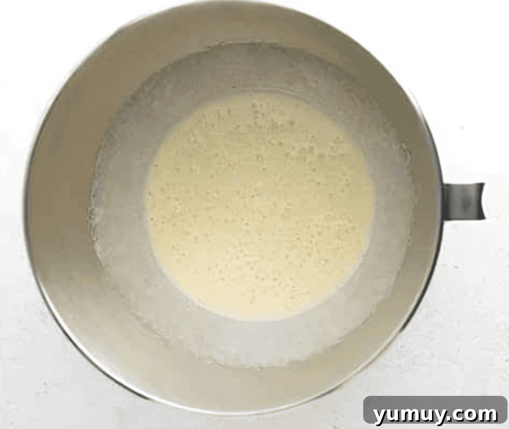 pale eggs in a stand mixer bowl.