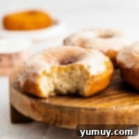 bite out of glazed donuts