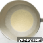 pale eggs in a stand mixer bowl.