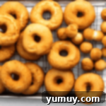 fried donuts on a wire rack.