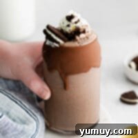 Creamy Oreo Dream 4 featured oreo milkshake in a tall glass with whipped cream and crushed cookies
