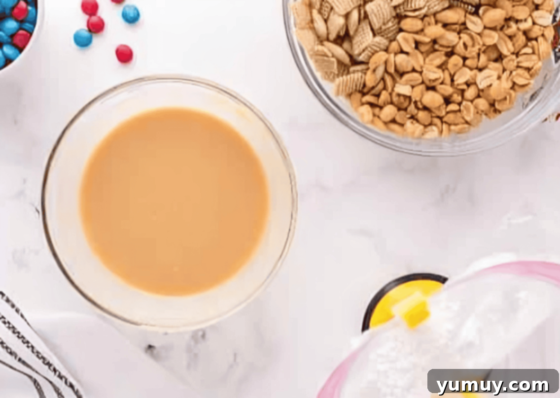 melted white chocolate chips and peanut butter in a glass bowl.