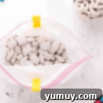 powdered sugar-coated chex mix in a ziplock bag.