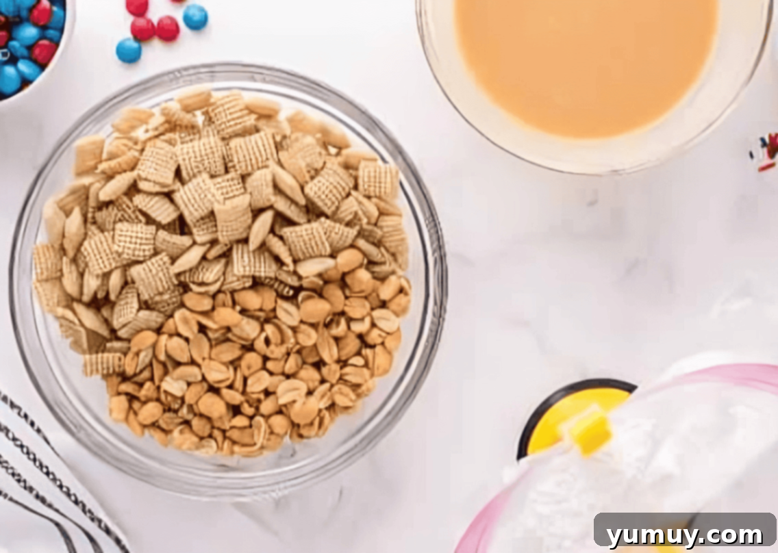 chex and peanuts in a glass bowl.