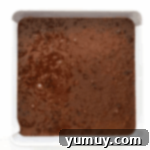 chocolate cake batter in a square baking pan.