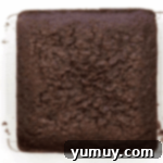 baked chocolate cake on a cooling rack.