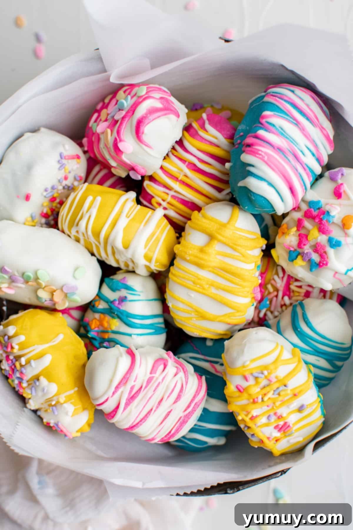 Vibrant Easter cookie dough truffles in a bowl, showcasing an array of festive colors.