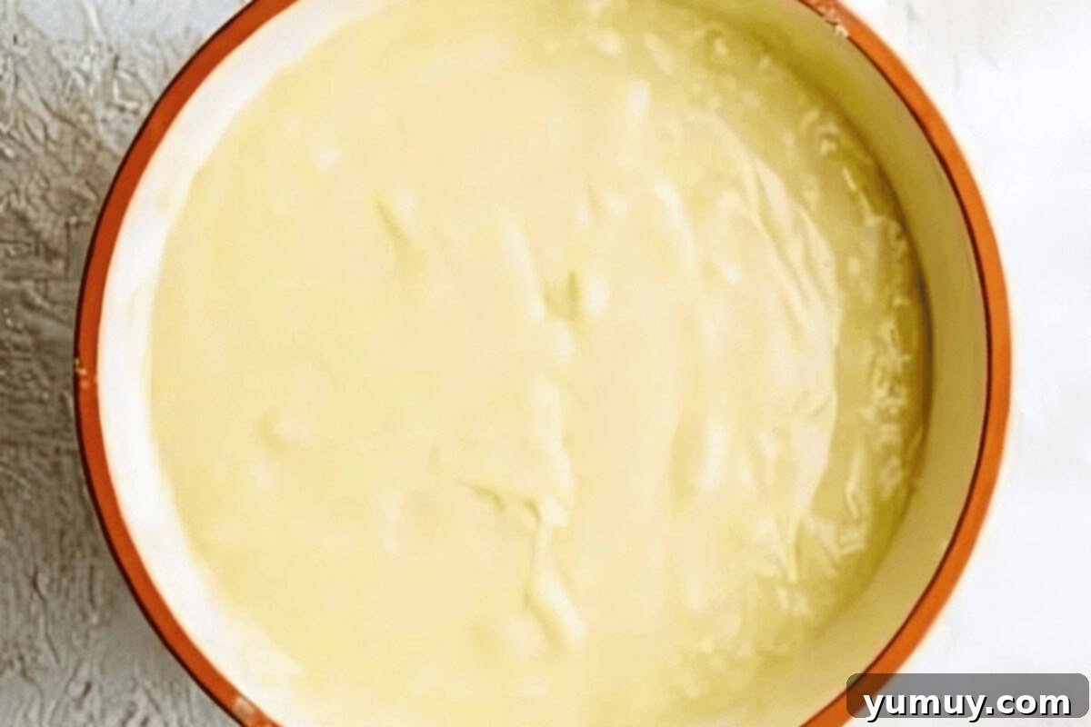 Luscious Vanilla Sheet Cake 12 cake batter in a white bowl.