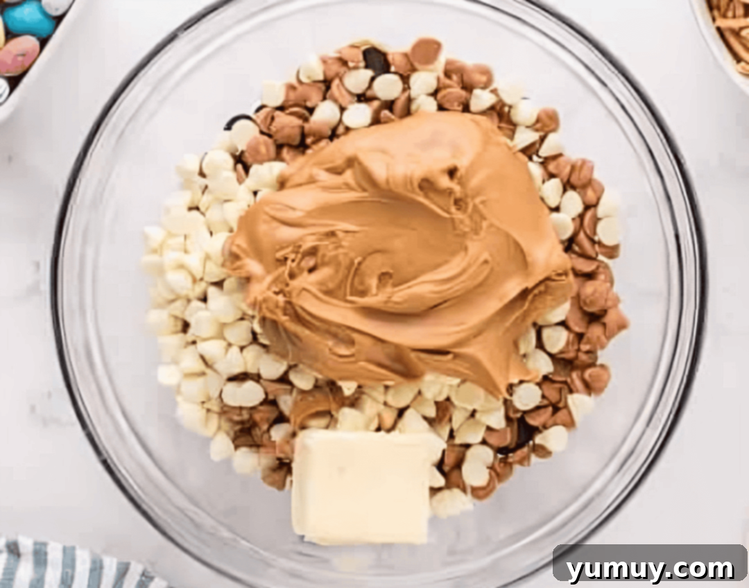 chocolate, butterscotch, and white chocolate chops in a glass bowl with peanut butter and butter.