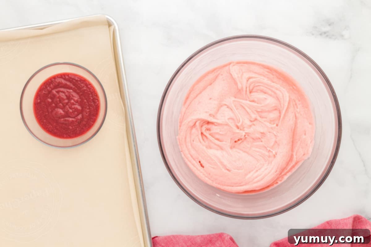 a bowl of strawberry cake batter next to a bowl of strawberry reduction.