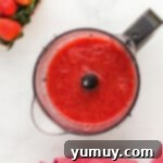 strawberry sauce in a food processor.
