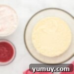 a bowl of ingredients for a strawberry rhubarb cake.