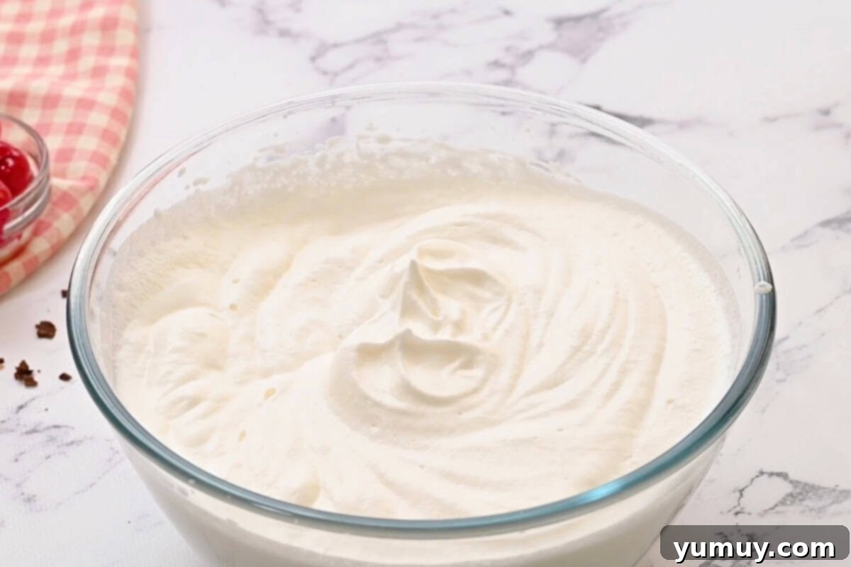 whipped cream in a glass bowl.