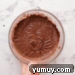 chocolate cupcake batter in a glass bowl.