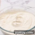 whipped cream in a glass bowl.