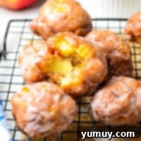Featured image of glazed deep fried apple fritters ready to eat.