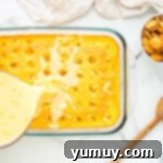 pouring pudding mixture on top of cake in a glass baking dish
