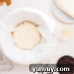 Homemade Cannoli Bliss 5 A bowl of chocolate waffles with whipped cream and chocolate chips.