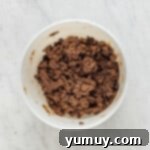 chocolate cake mix cookie dough with chocolate chips after mixing in a white bowl