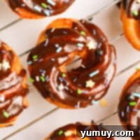 Crispy Chocolate Cruller Twists 4 overhead image of chocolate glazed crullers on a cooling rack