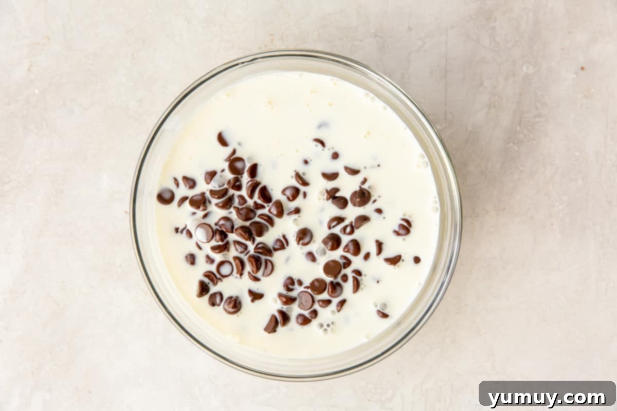 Decadent Chocolate Dream Cake 15 heavy cream and chocolate chips in a glass bowl