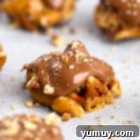 Irresistible Homemade Turtle Clusters 4 Homemade turtle candies neatly arranged on parchment paper, ready to be enjoyed.