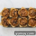 chocolate peanut butter muffins in a muffin tin after baking