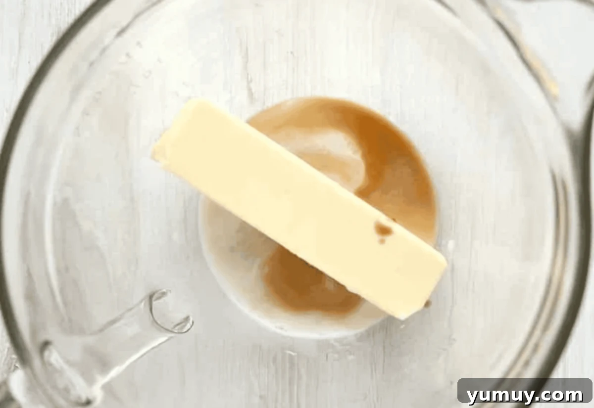 butter, milk, and vanilla in a glass bowl.