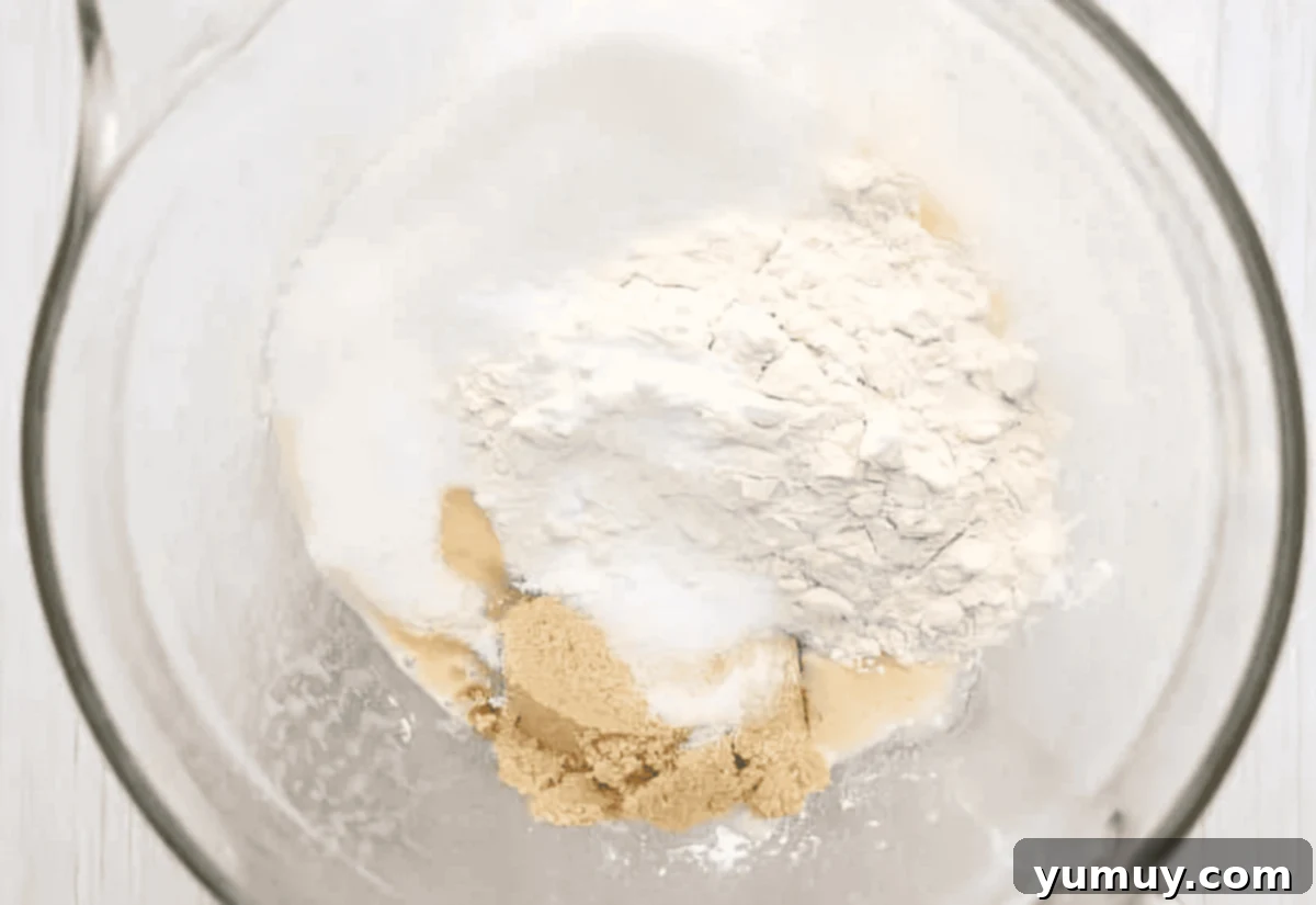flour and sugars in a glass bowl.