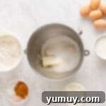 Golden Cinnamon Bundt Cake 11 butter and sugar in a stainless steel mixing bowl.