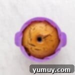 Golden Cinnamon Bundt Cake 16 baked churro bundt cake in a purple silicone bundt mould.