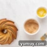 Golden Cinnamon Bundt Cake 17 baked churro bundt cake next to ingredients for churro bunt cake topping.