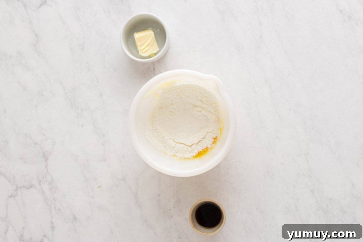 Golden Cinnamon Bundt Cake 22 sugar and cornstarch over whisked eggs in a white bowl.