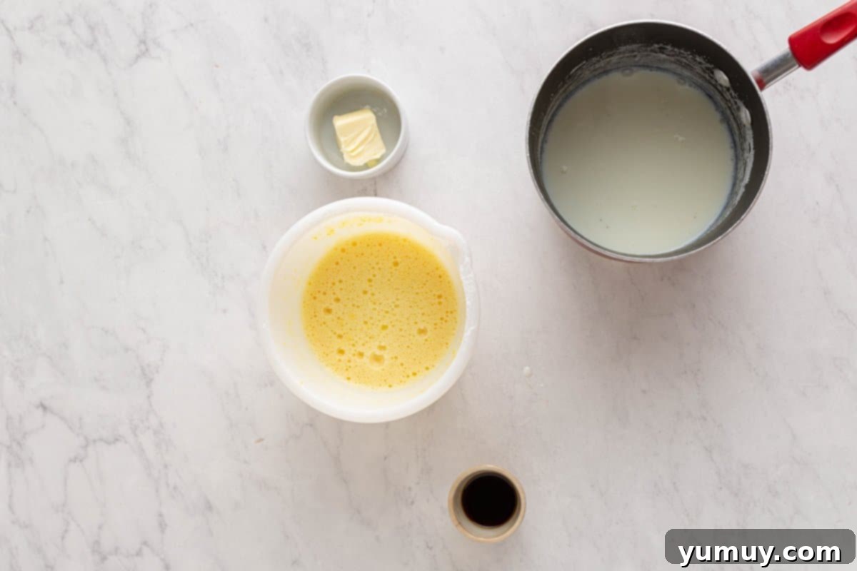 Golden Cinnamon Bundt Cake 23 sugar and milk mixture whisked into egg mixture in a white bowl.