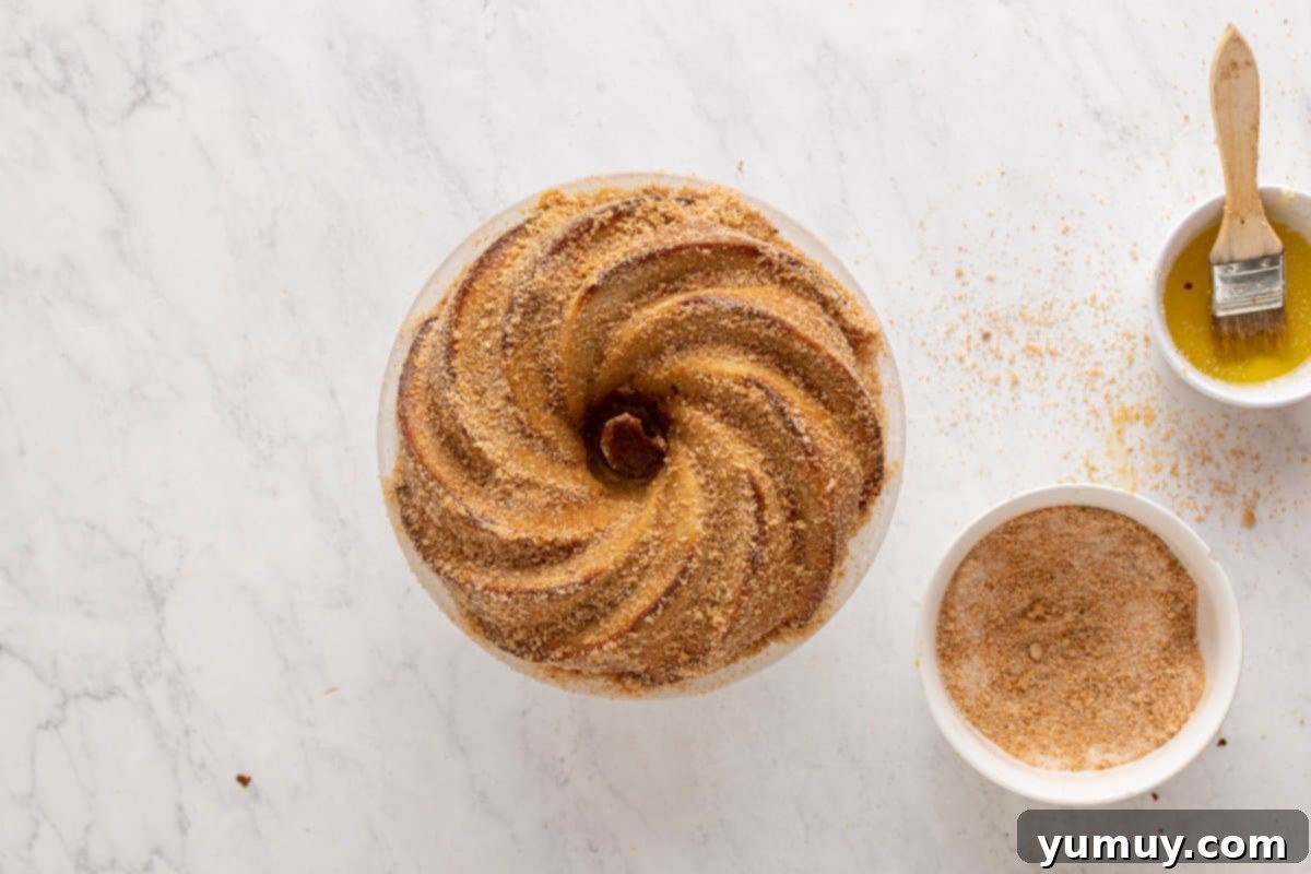 Golden Cinnamon Bundt Cake 33 baked churro bundt cake next to ingredients for churro bunt cake topping.