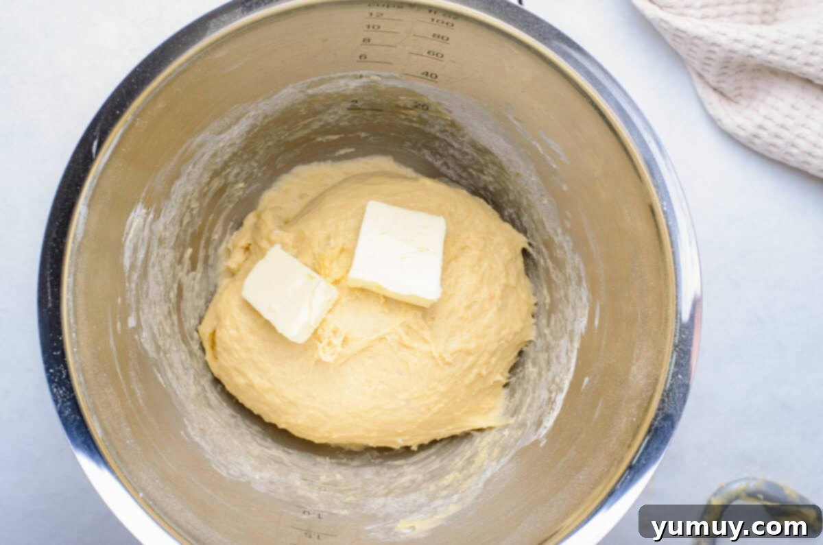 Homemade Krispy Kreme Glazed Donuts 14 butter in a mixing bowl.